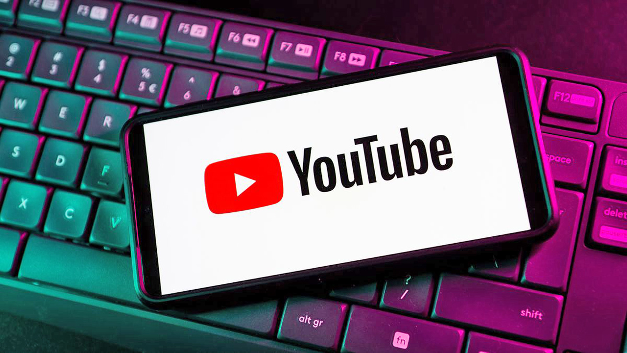 In this photo illustration a YouTube logo seen displayed on