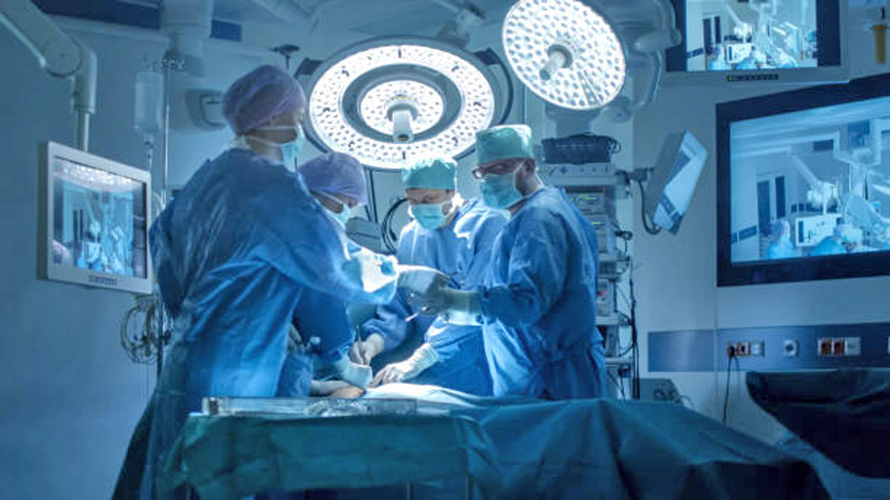 Medical Team Performing Surgical Operation in Modern Operating Room