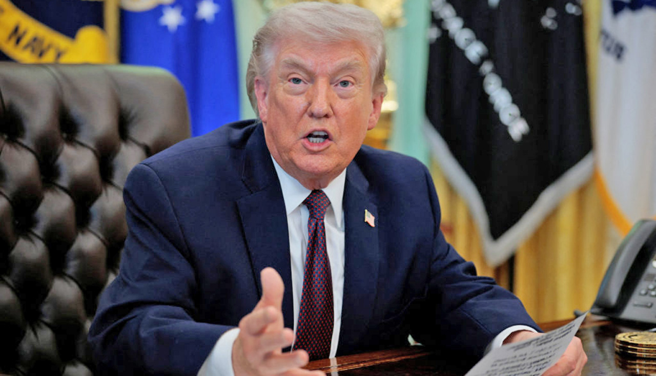 U.S. President Trump signs an executive order in the Oval Office of the White House